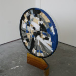 Wood, bicycle wheel, tape